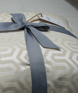 Pair of cream patterned cushions with goose down filling (50 x 50)